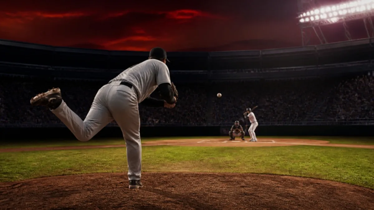 Baseball Regeln: Pitcher wirft vom Mound zur Home Plate bei Flutlicht
