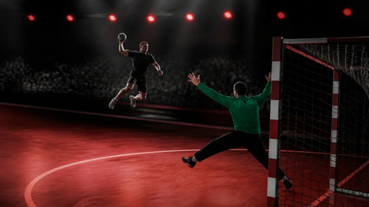 Handball Regeln: Spieler im Sprungwurf vor dem Kreis, Torwart wehrt ab